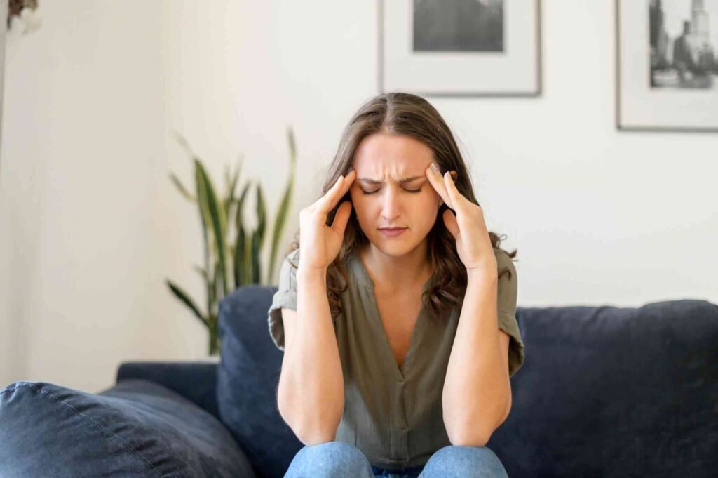 Woman resting quietly, representing emotional exhaustion in caregiving relationships