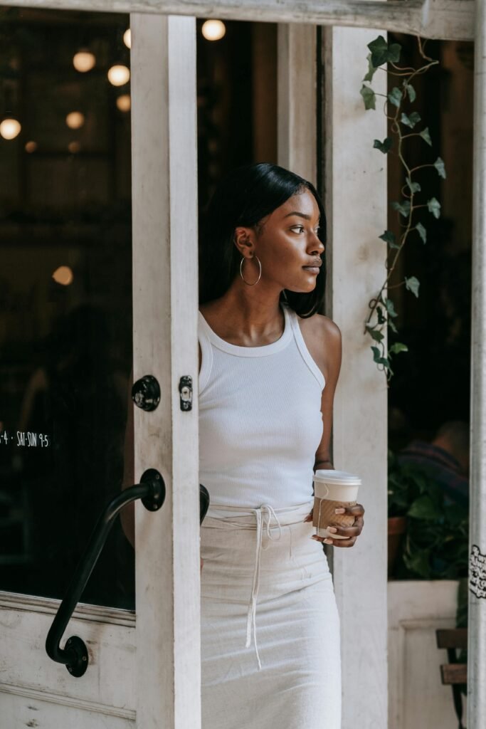 woman standing at door light